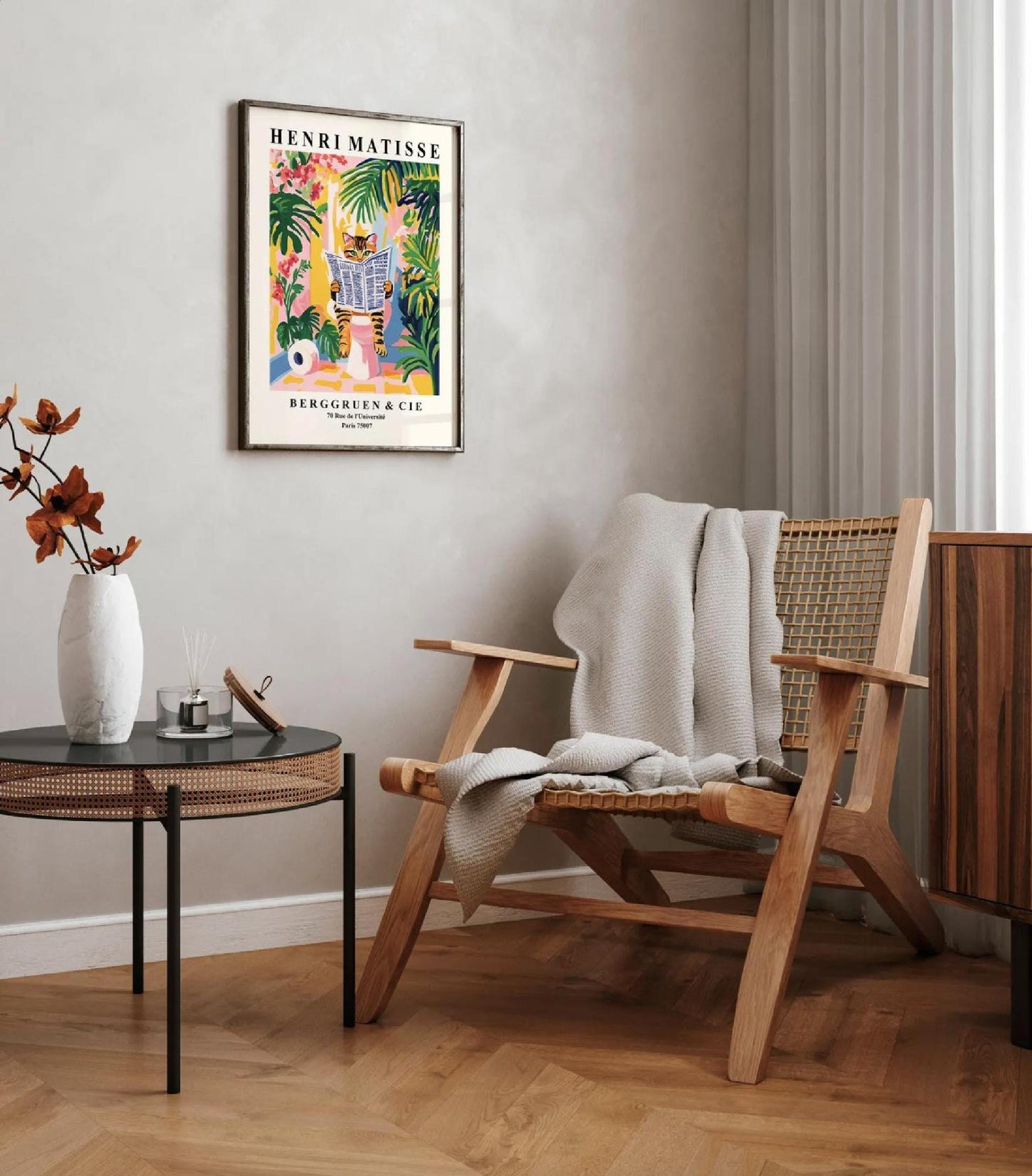 Framed Henri Matisse art print of a tabby cat reading a newspaper in a tropical setting.