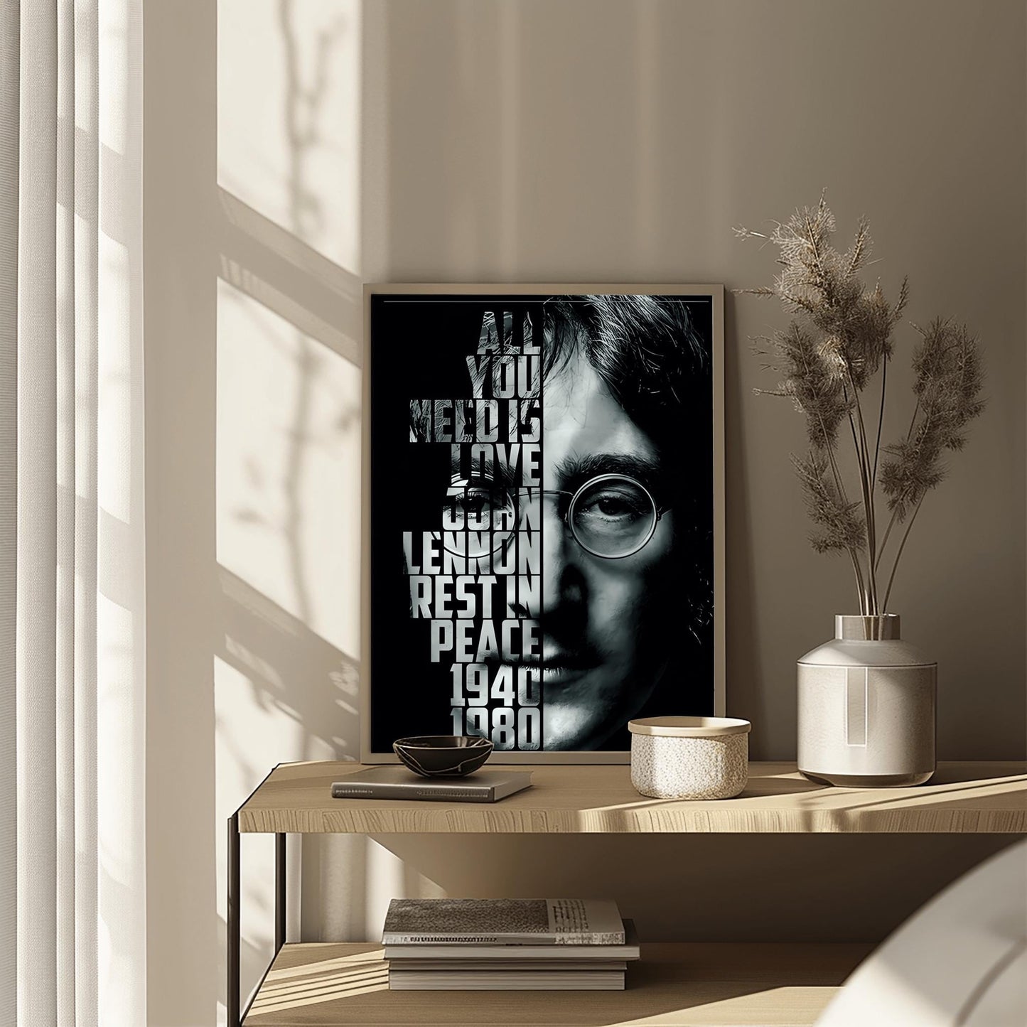 A striking physical poster print featuring a high-contrast black and white portrait of John Lennon, with the text 'ALL YOU NEED IS LOVE' and other meaningful phrases integrated into the design