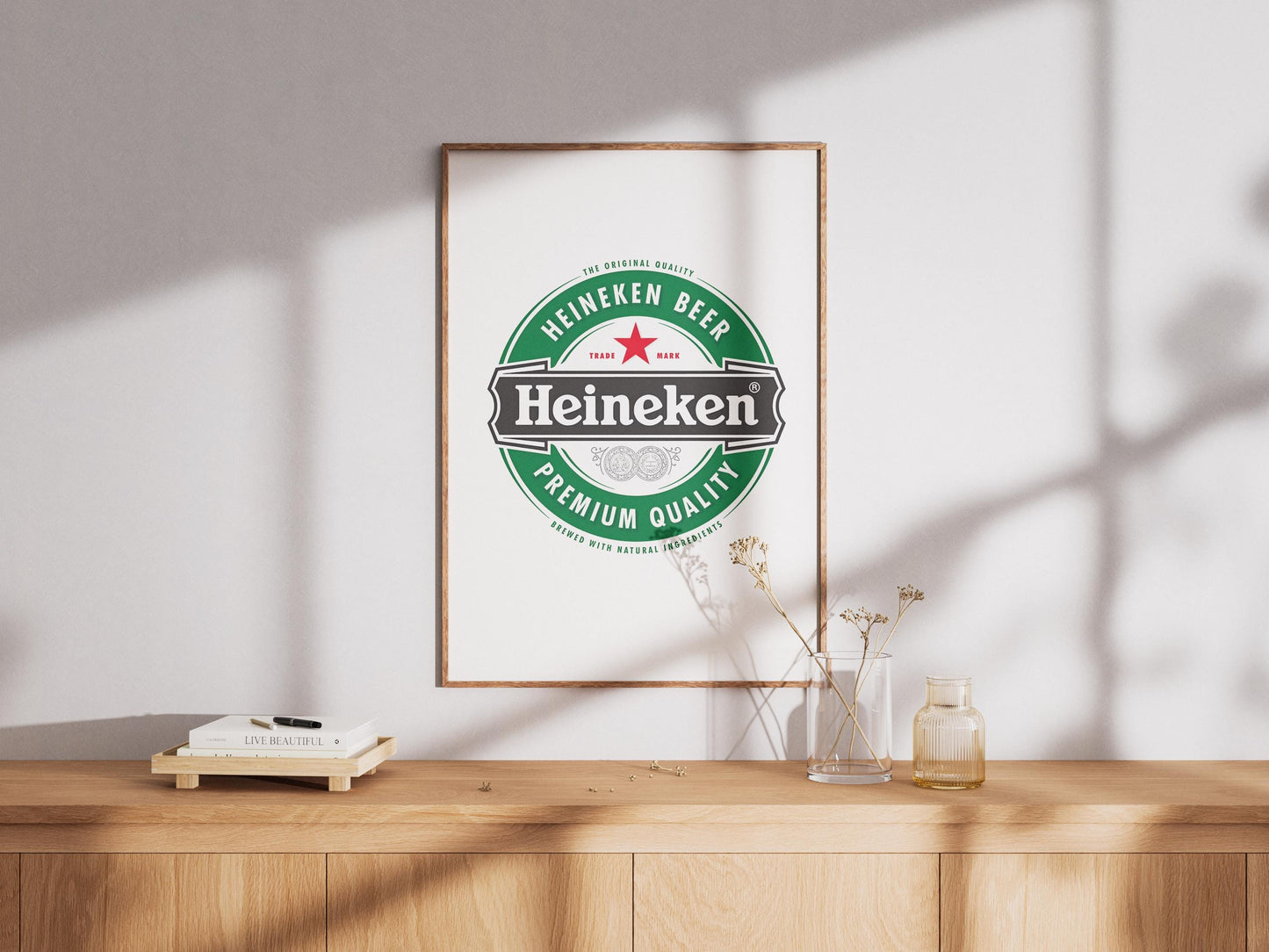 A sharp, bold art print featuring the iconic Heineken beer logo. The design prominently displays the vibrant green background, the distinct red star, and the crisp white 'Heineken' typography. This clean, graphic representation of the famous beverage brand is perfect for modern bar decor, a stylish man cave, pub wall art, or a contemporary kitchen. It's an ideal digital print gift for any Heineken enthusiast or collector of iconic beer branding, adding a sleek touch to any space.