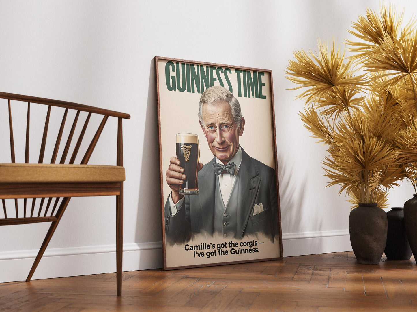 A humorous art print featuring King Charles III holding a classic pint of Guinness. The illustration shows him smiling with the iconic dark stout and creamy head. The text 'GUINNESS TIME' appears at the top, and 'Camilla's got the corgis — I've got the Guinness.' at the bottom, adding a witty royal touch. This unique print is ideal for pub or bar decor, a man cave, or as a quirky gift for fans of the British Royal Family and Guinness beer, blending humor with an iconic beverage