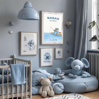 A vertical art print titled "BABAR goes fishing" in large blue letters. A grey elephant sits on a tan rocky pier overlooking blue water. He is wearing a blue and white checkered shirt, light blue overalls, and a white cap. He holds a thin fishing rod, and his line is in the water with a small red bobber. A red tackle box sits on the dock behind him. The name "Jean de Brunhoff" is at the bottom.