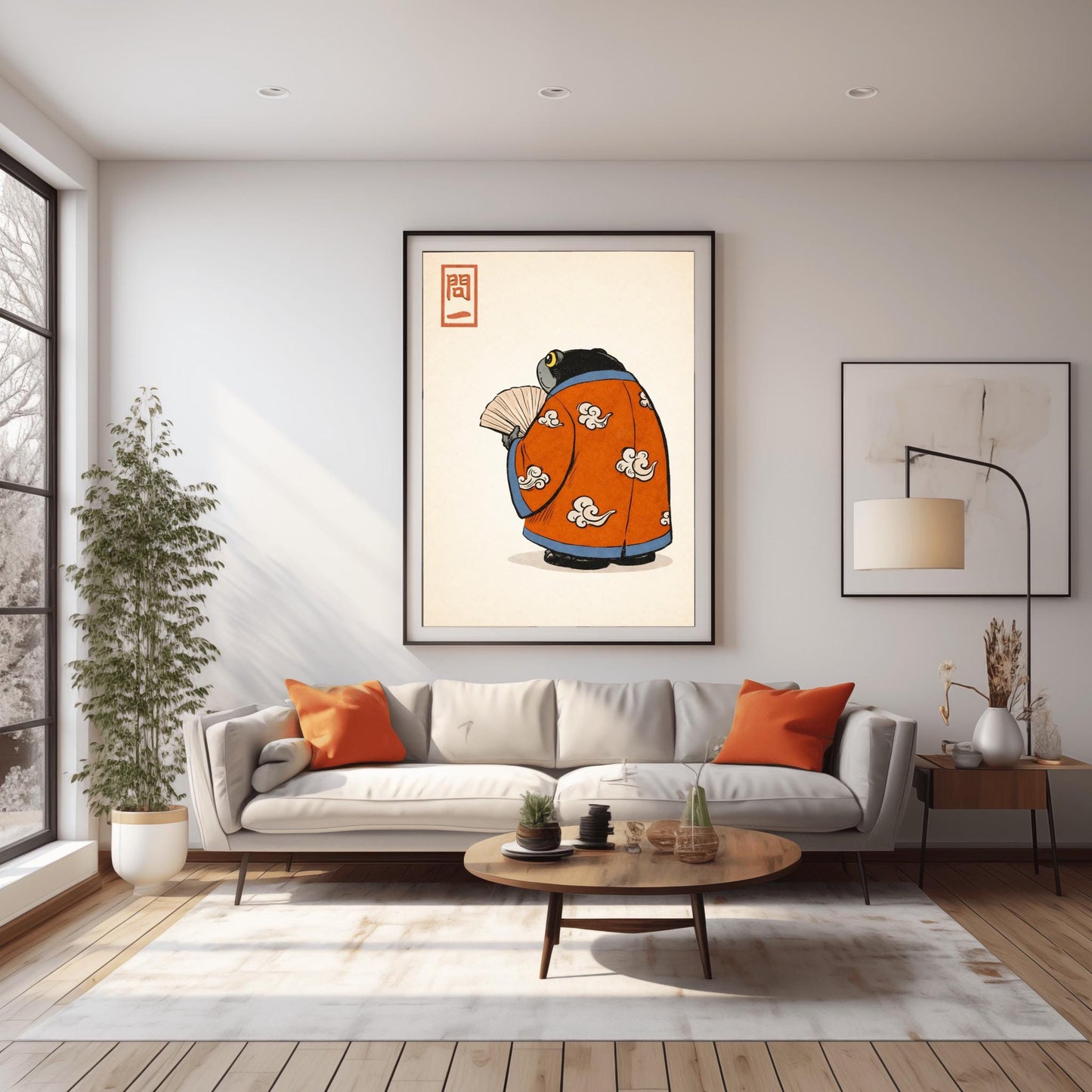 A vertical Japanese woodblock-style art print of a large, dark grey-black frog seen from behind. The frog is wearing an ornate burnt orange kimono decorated with white cloud motifs and blue piping. It holds a beige folding fan in its small hand. In the top left corner is a red rectangular stamp containing Japanese calligraphy. The entire image is set against a textured, pale cream background in a minimalist aesthetic.