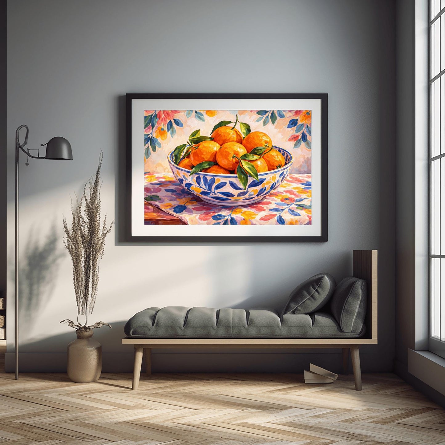 A horizontal painterly illustration of a large blue and white patterned ceramic bowl filled with bright oranges and green leaves. The bowl sits on a table covered with a pink and yellow floral cloth, with a matching soft floral pattern in the background.