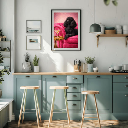 A vertical oil-style painting of a sophisticated black poodle with fluffy, well-groomed fur. The poodle is lying on a vibrant hot pink velvet tufted sofa. In the foreground, a martini glass with two green olives sits on a polished round gold side table. The background is a textured light pink, and the overall mood is glamorous, colorful, and maximalist.
