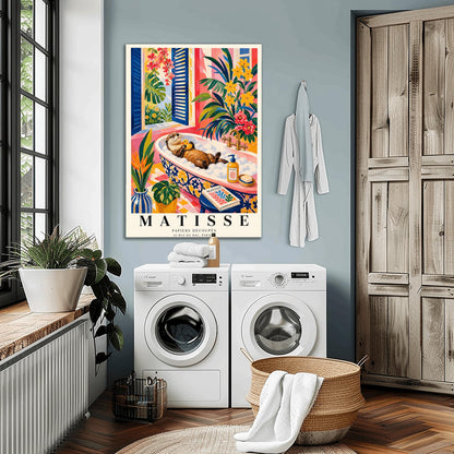A vertical maximalist art print designed as a Henri Matisse exhibition poster. A brown otter floats on its back in a pink bubble bath, holding a small yellow rubber ducky. The bathtub has a blue and yellow floral pattern. The room is filled with vibrant tropical plants, pink walls, and yellow checkered tiles. A blue-shuttered window looks out onto a sunny garden. In the foreground, an art book and a striped vase are visible. Bold black text at the bottom reads "MATISSE PAPIERS DÉCOUPÉS"