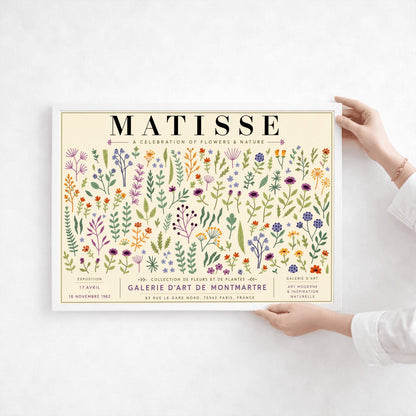 A vertical gallery exhibition poster with a warm cream border. Bold black text at the top reads "HENRI MATISSE". The central artwork is a rectangular block with a solid sand-beige background, featuring a cream silhouette of an abstract, four-petaled flower with a circular center.