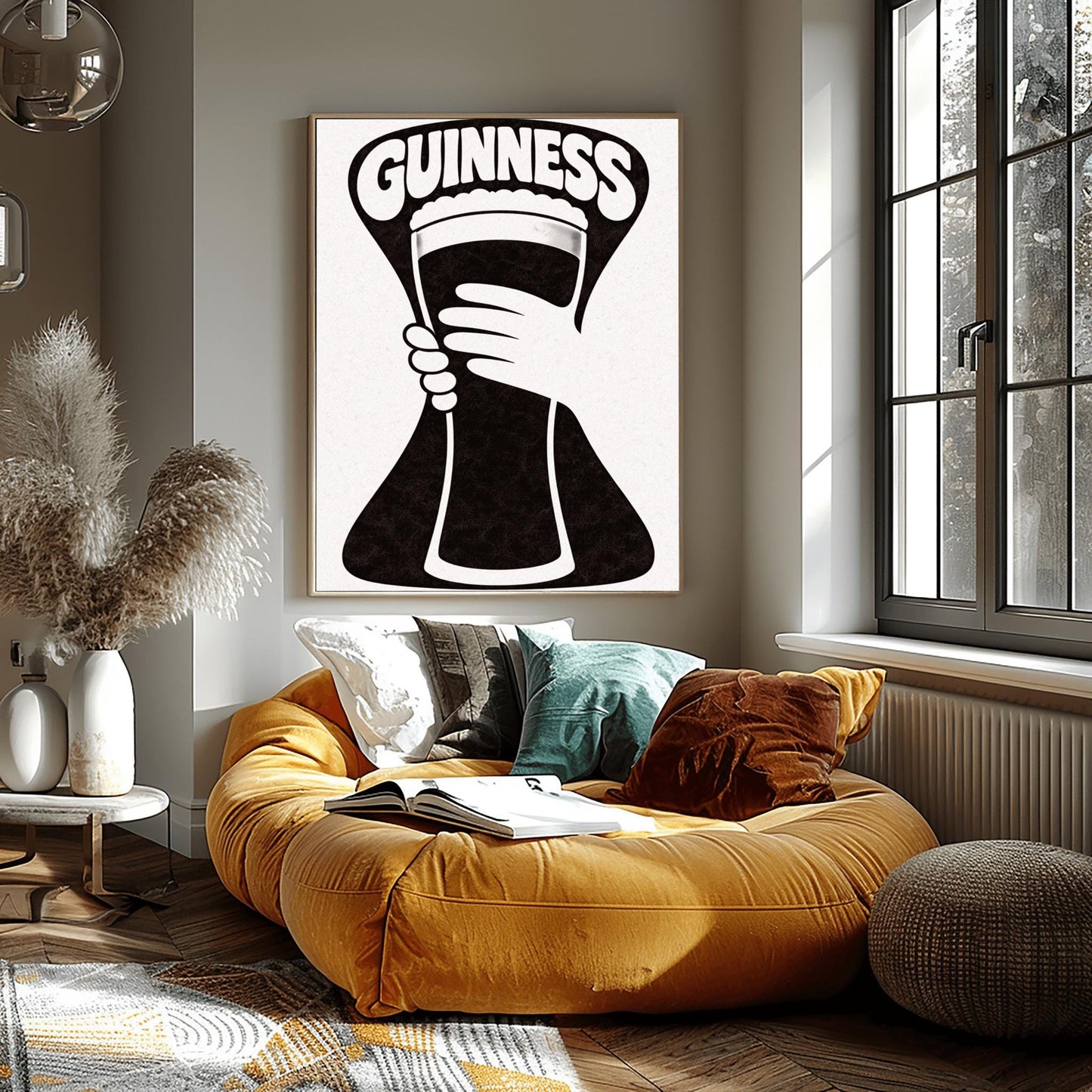 A vertical minimalist graphic in black and white. A large, black hourglass-shaped background features a white hand silhouette holding a pint glass made of negative space. The word "GUINNESS" is arched in bold white text at the top.