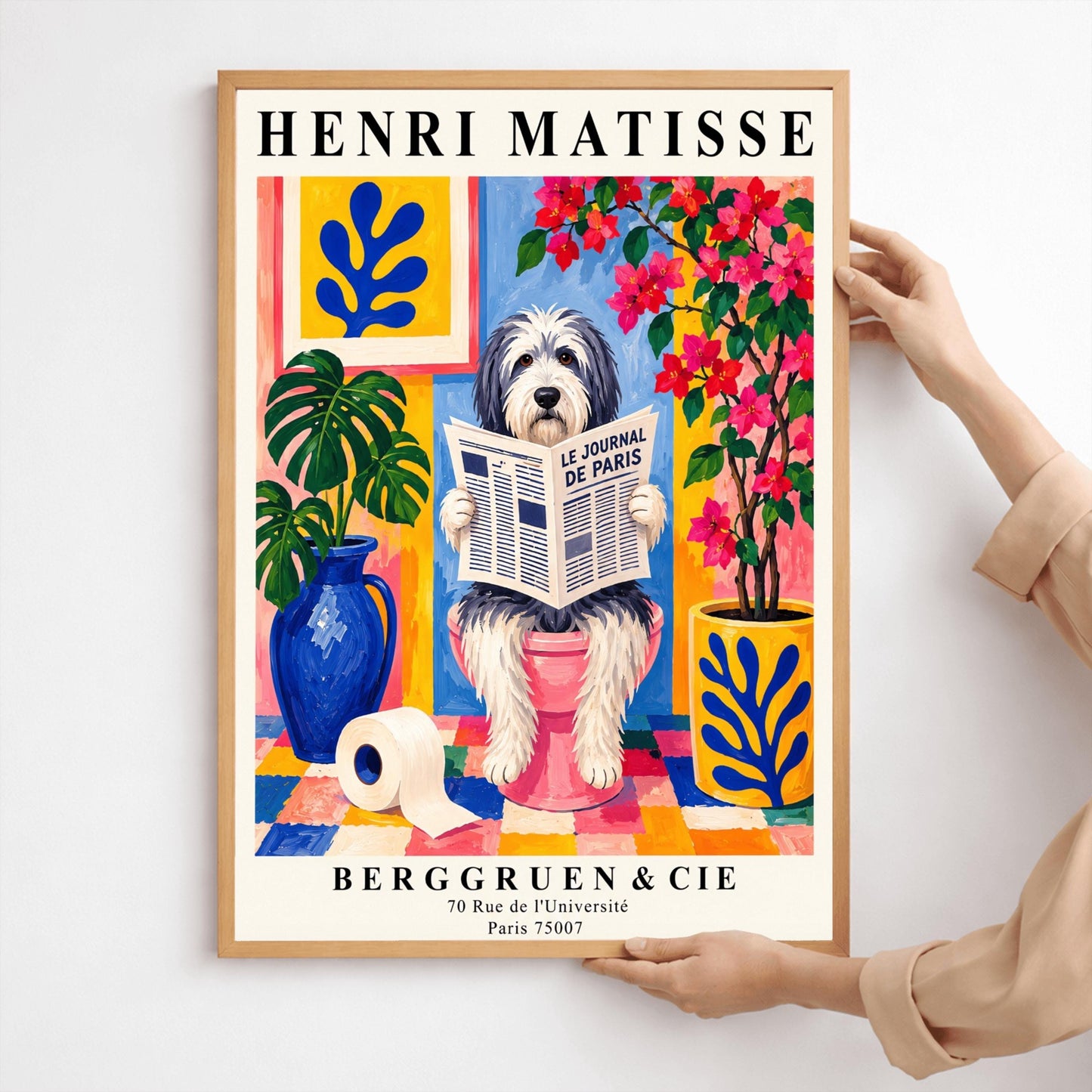 A vertical retro exhibition poster for Henri Matisse featuring a wide cream border. The central image shows a colorful Fauvism-style painting of a fluffy black-and-white Bearded Collie dog sitting on a pink toilet. The dog has shaggy fur and is looking forward while holding open a newspaper titled "LE JOURNAL DE PARIS". The background is a vibrant bathroom with a checkered mosaic floor, blue and yellow planters holding green monstera leaves