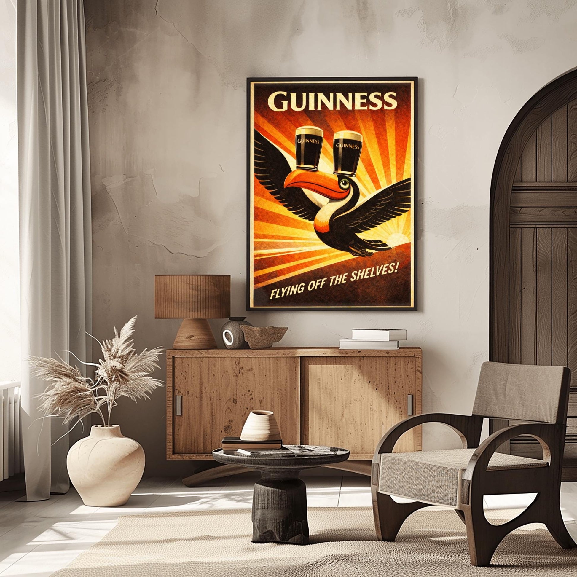 A vertical vintage-style advertising poster for Guinness. A toucan flies upward towards the top left, balancing two pints of beer on its beak. A large orange sunburst radiates from the bottom right background. Text at the top reads "GUINNESS" and the bottom reads "FLYING OFF THE SHELVES!"