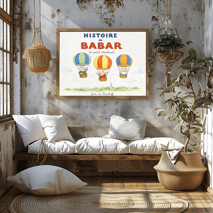 A whimsical vintage-style storybook poster on a clean white background titled "HISTOIRE de BABAR le petit éléphant" in bold blue and orange lettering. The illustration features three cartoon elephants floating in striped hot air balloons over a light green watercolor countryside with a white church steeple. On the left, King Babar in a green suit and crown waves from a blue-and-green balloon. In the center, an elephant in a red dress sits in a yellow-and-orange balloon.