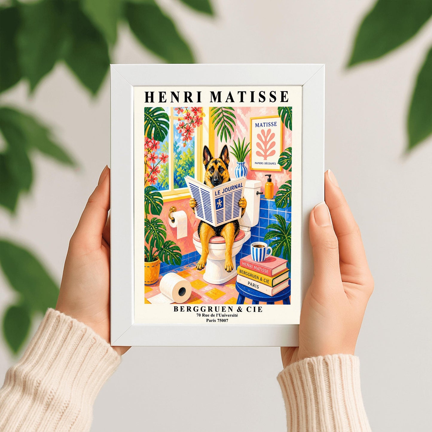 A vertical maximalist art print designed as a Henri Matisse exhibition poster. A tan and black German Shepherd is sitting upright on a white toilet, holding and reading a newspaper titled "Le Journal." The bathroom is vibrantly colored with pink walls, blue wall tiles, and a pink and yellow checkered floor. The room is filled with large green tropical plants and red flowers. A stack of art books and a striped mug sit on a blue stool.