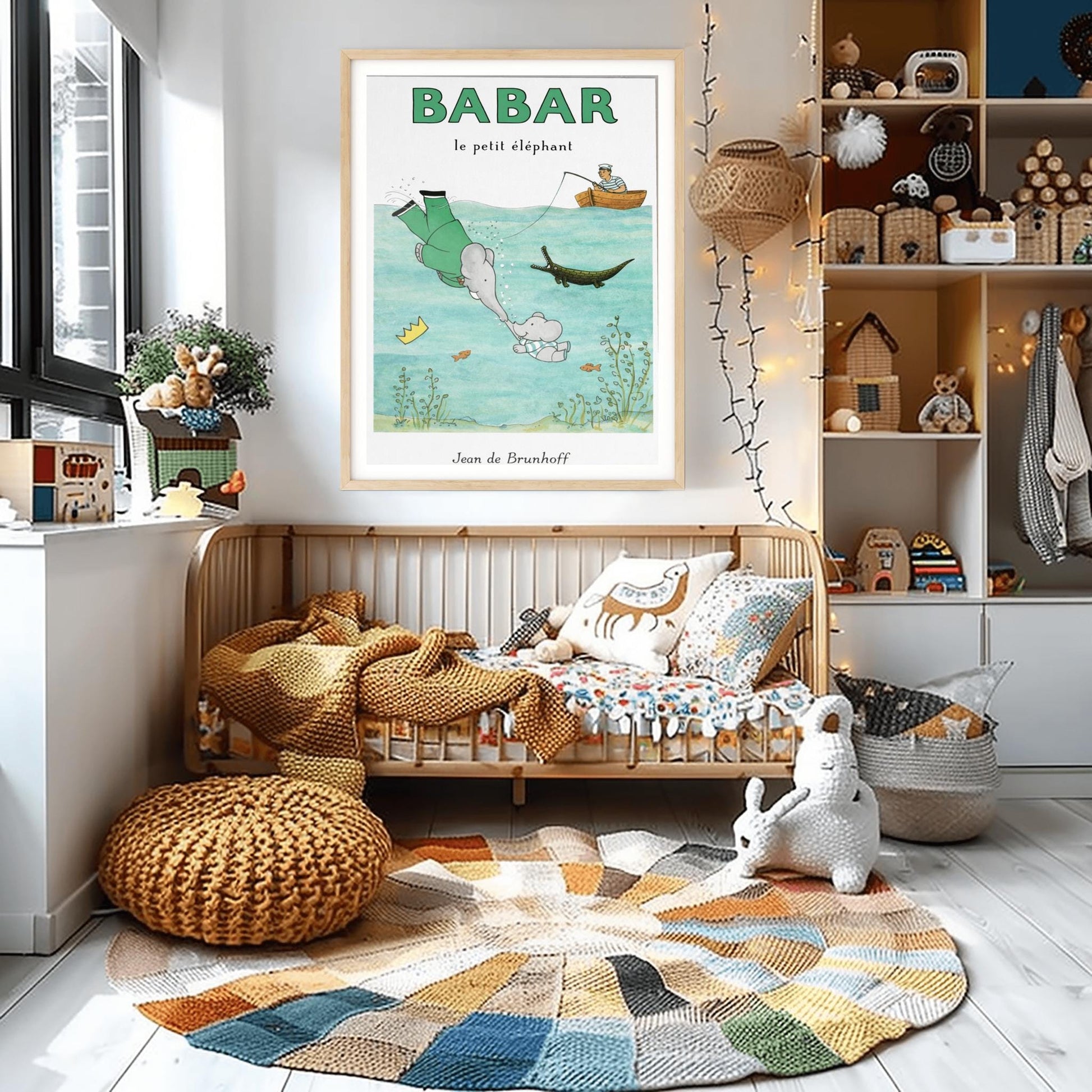 A vertical children's illustration poster titled "BABAR le petit éléphant" at the top in green. The scene shows King Babar in a green suit diving underwater to touch trunks with a small elephant calf. His golden crown floats nearby. Above the water, a man in a striped shirt sits in a rowboat fishing. A crocodile and several small orange fish swim in the water among green aquatic plants. The name "Jean de Brunhoff" is at the bottom.