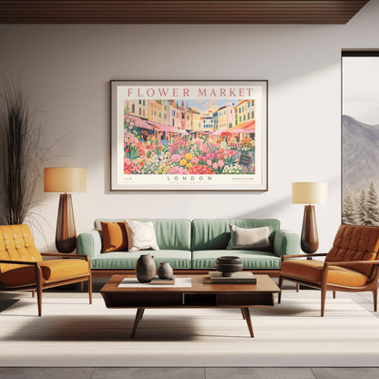 A vintage-style exhibition poster titled "FLOWER MARKET" at the top and "LONDON" at the bottom. The illustration depicts a vibrant open-air market scene packed with dense stalls of pink tulips, yellow ranunculus, and assorted green foliage. In the background, a row of colorful, multi-story pastel buildings stands under a light blue sky with soft white clouds, with shoppers walking between the stalls.