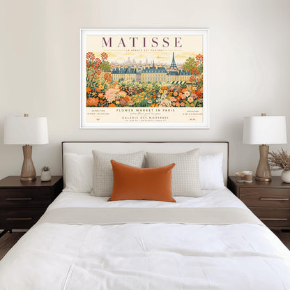 A French art exhibition poster titled "MATISSE" across the top. The central illustration shows a sprawling field of dense, colorful wildflowers in shades of orange, yellow, and white. In the background, classic Parisian buildings and the silhouette of the Eiffel Tower stand under a soft yellow sky. The text at the bottom reads "Flower Market in Paris, Galerie des Modernes, 24, Rue de l'Université, Paris."