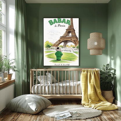A vertical art print titled "BABAR à Paris" in large green letters. A grey elephant, Babar, seen from behind wearing a green suit and black cap, stands on a green lawn looking toward the massive Eiffel Tower. The scene includes green trees, a distant cityscape with crowds of people, and a soft blue sky. The artist's name, "Laurent de Brunhoff," is printed in script at the bottom.