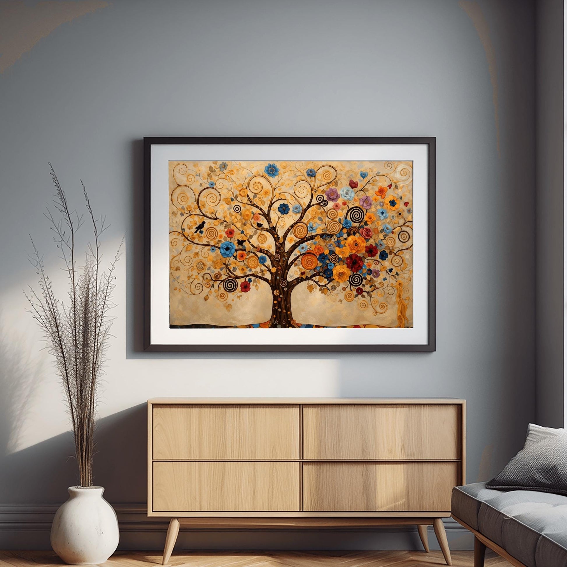 A horizontal fine art print in the style of Gustav Klimt. A large tree with dark branches that curl into golden spirals fills the frame. The tree is decorated with a variety of colorful blue, orange, and red flowers and small black birds. The background is a warm cream color with faint, swirling patterns.