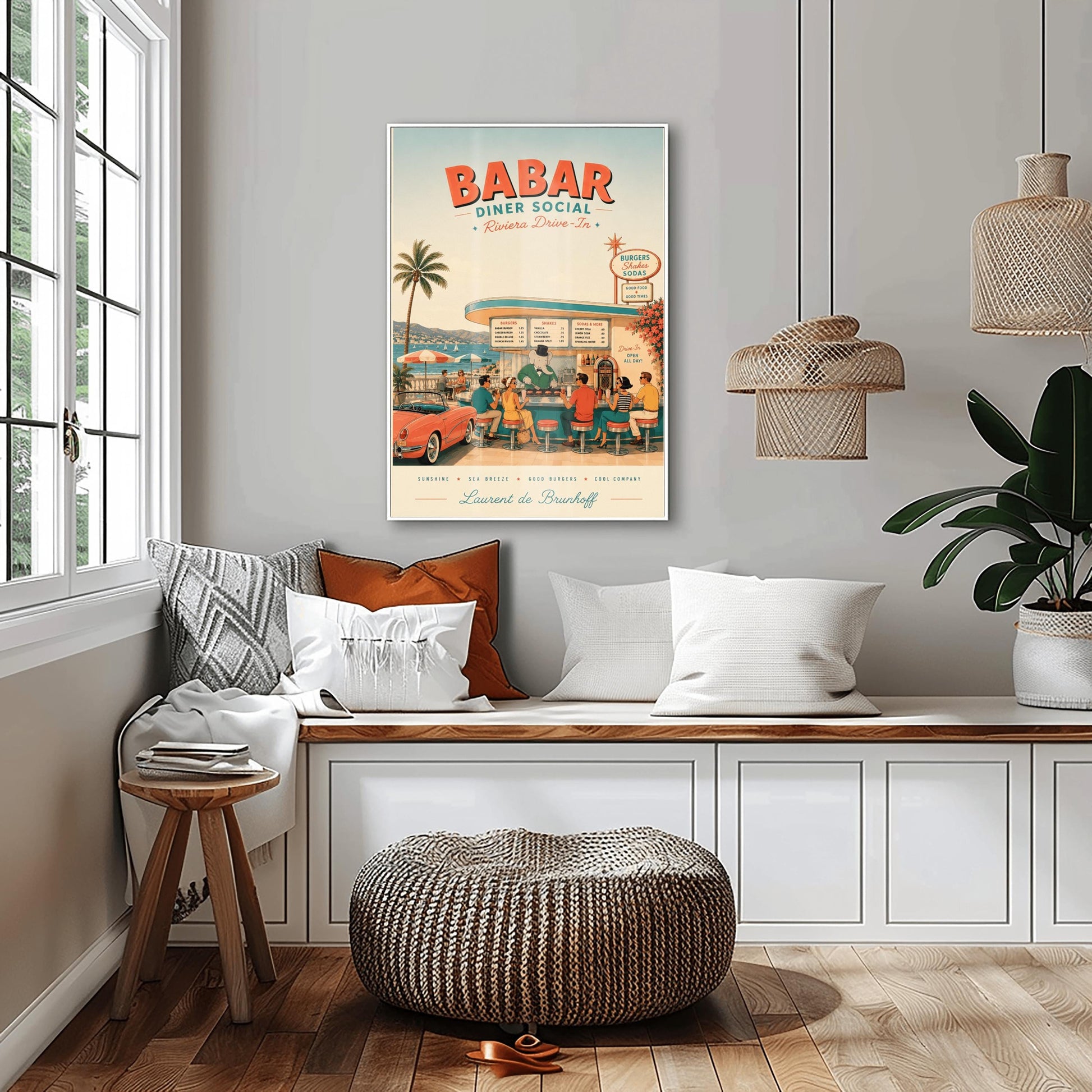 A mid-century style illustration poster titled "BABAR DINER SOCIAL - Riviera Drive-In" at the top. The scene shows an open-air retro diner bar right on the coast of the French Riviera, with a turquoise sea and white sailboats in the background. King Babar, a cartoon elephant in a green suit, bowtie, and top hat, cooks burgers on a grill behind the counter. Stylishly dressed patrons from the 1950s sit on red-topped stools, and a classic pink convertible sports car is parked on the left