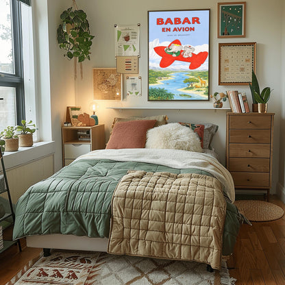 A vertical children's illustration poster titled "BABAR EN AVION" in large red letters. At the center is a bright red propeller plane flying through a blue sky with white clouds. King Babar, in a green suit and crown, and Queen Celeste, in a white sailor-style hat, are sitting in the cockpits. Below them is a winding blue river and a green savanna with a giraffe, a lion, a hippopotamus, and palm trees. The name "Jean de Brunhoff" is at the top.