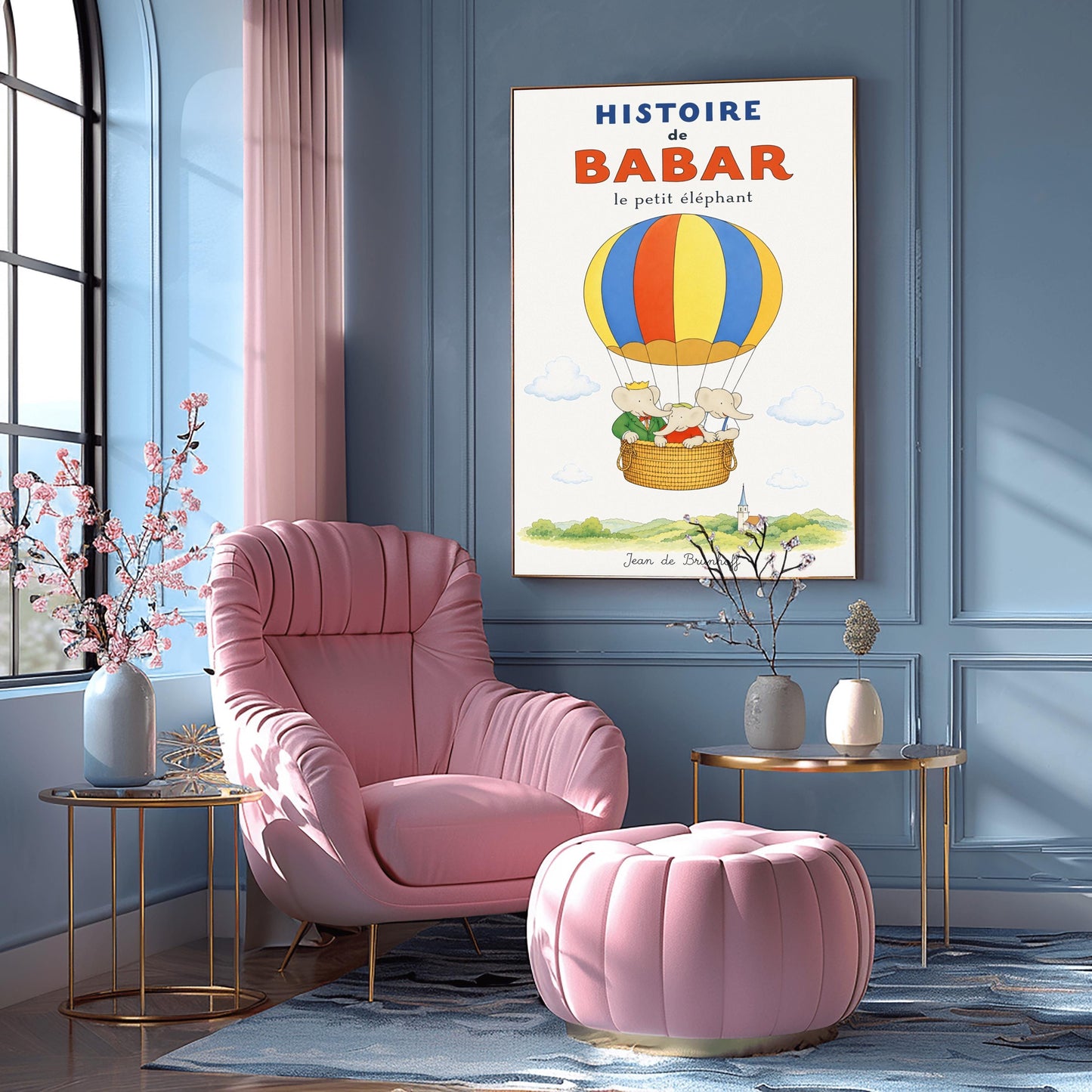 A vertical vintage-style storybook poster on an off-white background titled "HISTOIRE de BABAR le petit éléphant" in bold blue and orange font. The illustration features a large hot air balloon with yellow, blue, and orange stripes floating in a sky with soft clouds. Inside the wicker basket, three cartoon elephants ride together. On the left, King Babar wears a green suit and crown while pointing ahead. The other two young elephants wear red and white shirts.