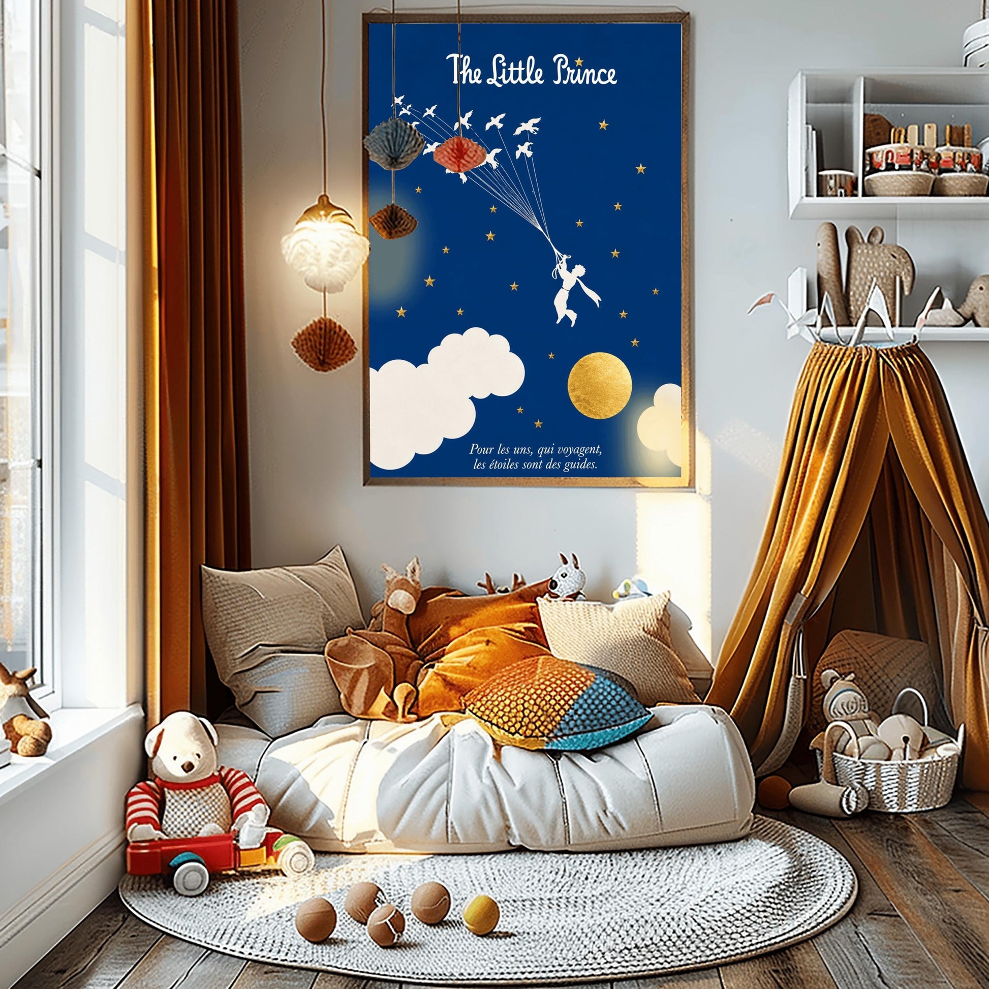 A vertical art print with a deep indigo blue background. A small white silhouette of a boy, the Little Prince, is being pulled upward by a flock of white birds on long strings. The sky is filled with small gold stars and large white clouds at the bottom, next to a textured gold moon. The title "The Little Prince" is at the top in white script, and a French quote is at the bottom in white italics.