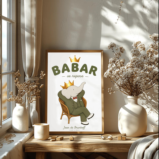 A vertical minimalist art print of Babar the Elephant relaxing in a brown wicker armchair against a solid white background. Babar is wearing a green suit, a red bowtie, and a golden crown. He is leaning back with his hands behind his head and legs crossed. At the top, bold sage green text reads "BABAR" with a gold crown above it and "se repose" in script between two dashes. The name "Jean de Brunhoff" is written in gold at the bottom.