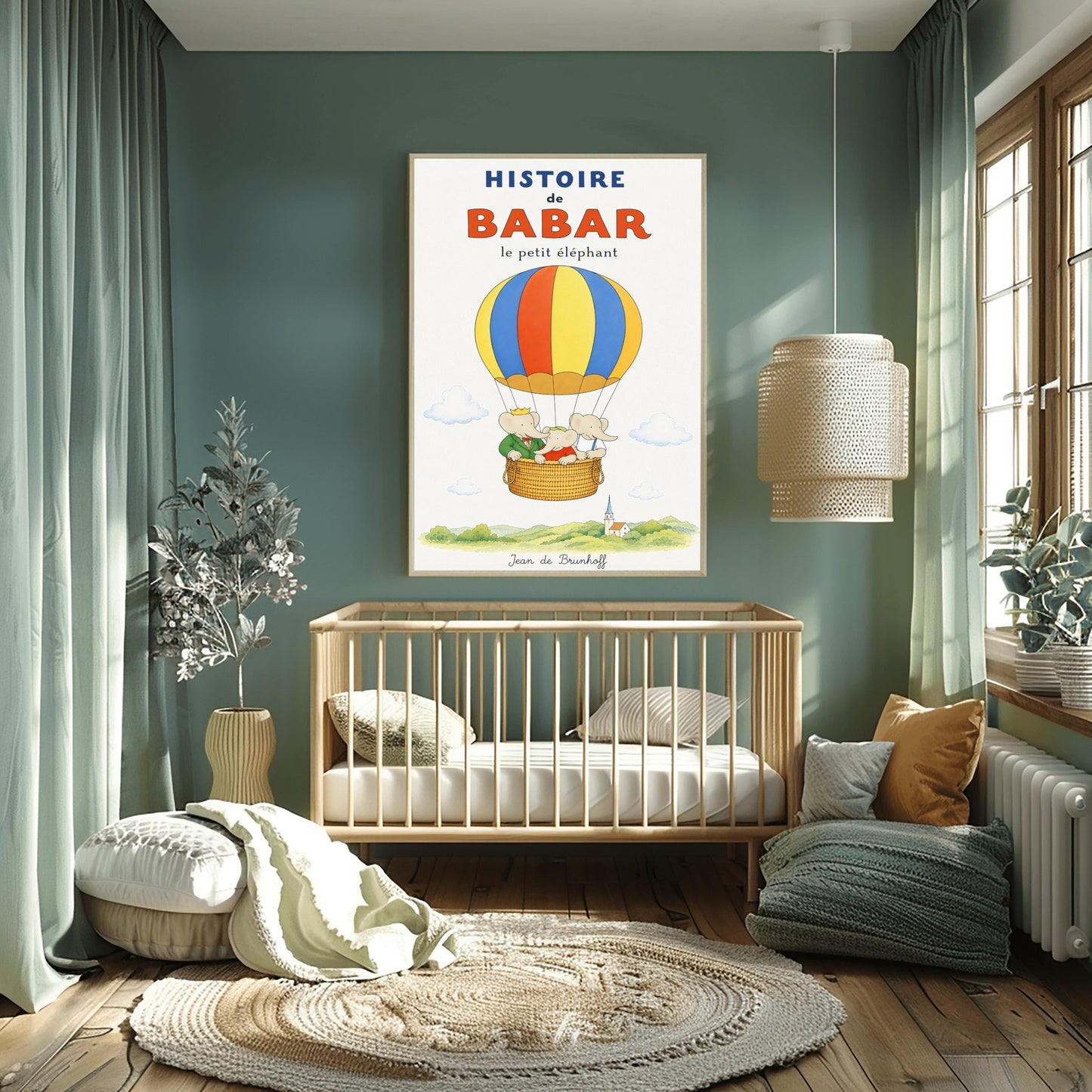 A vertical vintage-style storybook poster on an off-white background titled "HISTOIRE de BABAR le petit éléphant" in bold blue and orange font. The illustration features a large hot air balloon with yellow, blue, and orange stripes floating in a sky with soft clouds. Inside the wicker basket, three cartoon elephants ride together. On the left, King Babar wears a green suit and crown while pointing ahead. The other two young elephants wear red and white shirts.
