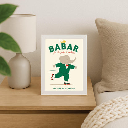 A vertical storybook-style art print of Babar the Elephant roller skating against a cream background. Babar is wearing his signature green suit and red bow tie. He is balanced on white roller skates with red wheels, with one foot lifted behind him. The top of the print features the word "BABAR" in large green letters above the red script text "fait du patin à roulettes" and a small gold crown. The name "LAURENT DE BRUNHOFF" is printed at the bottom.