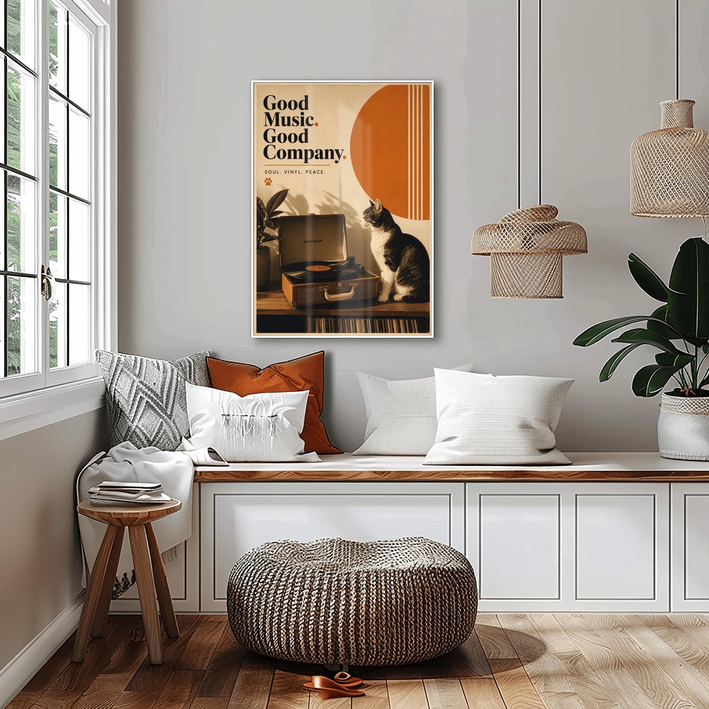 A vertical retro fine art poster titled "Good Music. Good Company." on a wide cream border. The design features a bold black serif heading on the left above the text "SOUL. VINYL. PEACE." and a small orange paw print. In the central artwork, a black and white tuxedo cat sits contentedly next to an open tan Crosley record player spinning a vinyl record. A large orange sun shape with white vertical stripes and a potted rubber plant decorate the background.