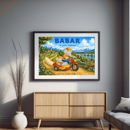 A horizontal watercolor illustration featuring Babar the Elephant and a smaller elephant riding a red motorcycle with a yellow sidecar down a dirt road. Both wear orange jackets and orange-and-yellow helmets. They are driving away from a European village toward a valley where a train crosses a stone bridge. In the background are tall, snow-capped mountains under a blue sky. A wooden sign points toward "Célesteville" and "Lac Zéphir."