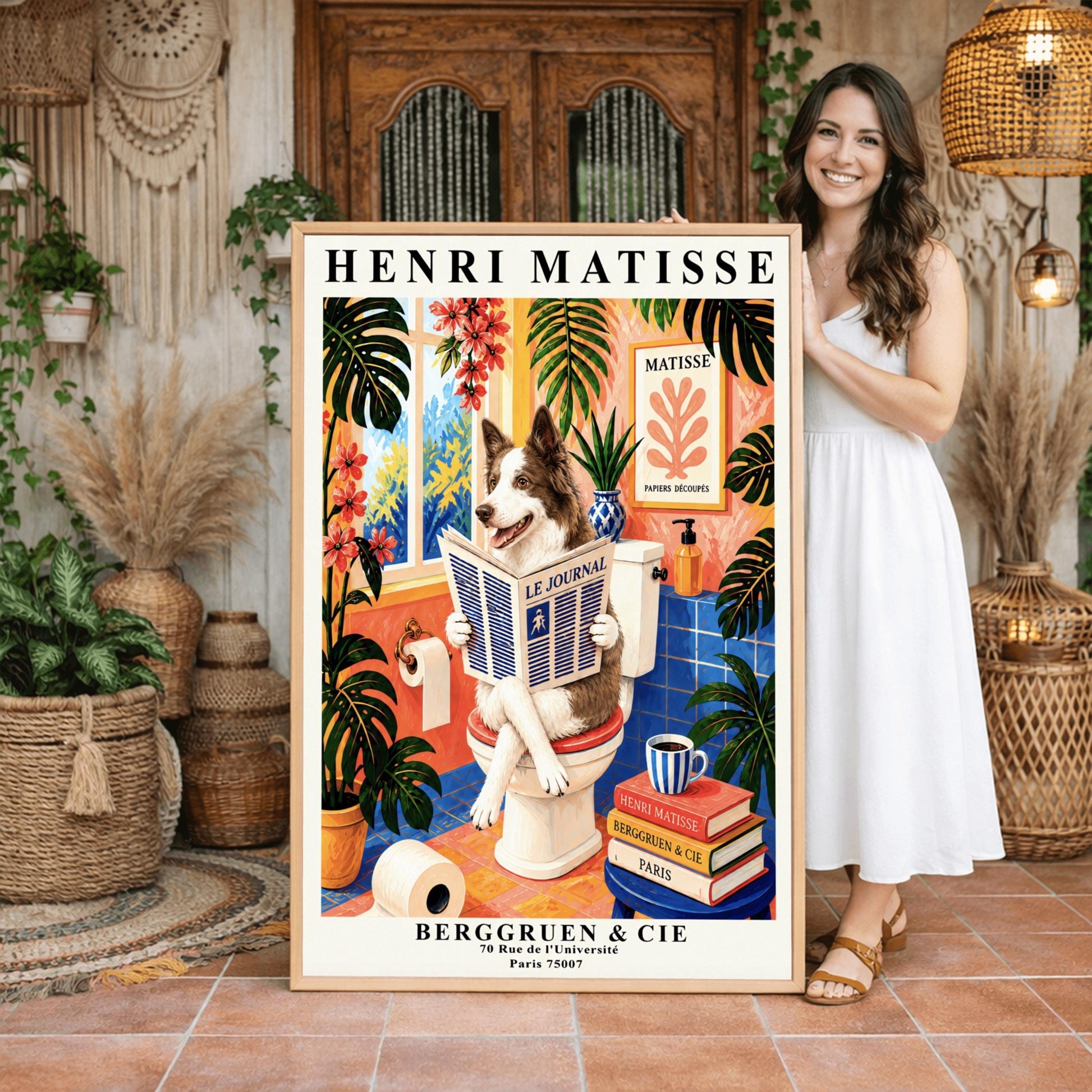 A vertical retro French exhibition poster styled after Henri Matisse with a wide ivory border. The central image shows a vibrant bathroom illustration where a fluffy brown-and-white border collie dog sits upright on a white toilet, holding and reading a newspaper titled "LE JOURNAL" with a happy, alert expression. The room features cobalt blue floor and wall tiles, coral pink walls, and large potted monstera plants with cascading pink flowers