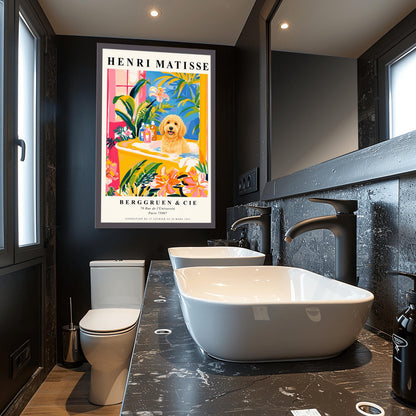 A vertical minimalist fine art exhibition poster in the style of Henri Matisse, shown framed on a wall above a luxury white bathtub. The poster has a wide white border with bold black text reading "HENRI MATISSE" and "BERGGRUEN & CIE". In the center painting, a fluffy golden doodle dog sits happily inside a yellow bathtub surrounded by vibrant pink, blue, and green tropical plants and orange flowers.