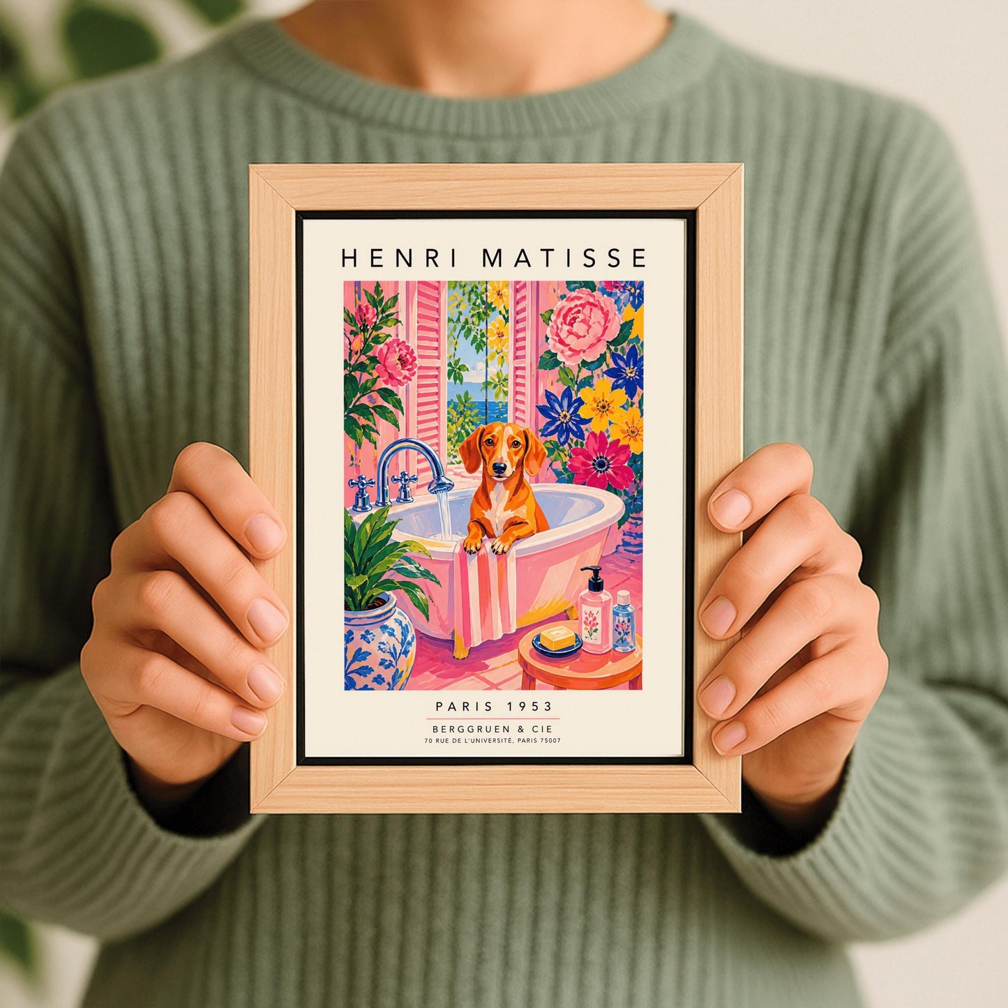 A vertical maximalist art print styled as a Henri Matisse exhibition poster. A brown Dachshund dog sits in a pink bathtub while water pours from a silver faucet. The room features vibrant pink walls and floors, decorated with very large pink, blue, and yellow flowers. A blue and white floral pot sits in the foreground along with a small stool holding soap and bottles. An open window in the background shows a blue sea and green leaves.