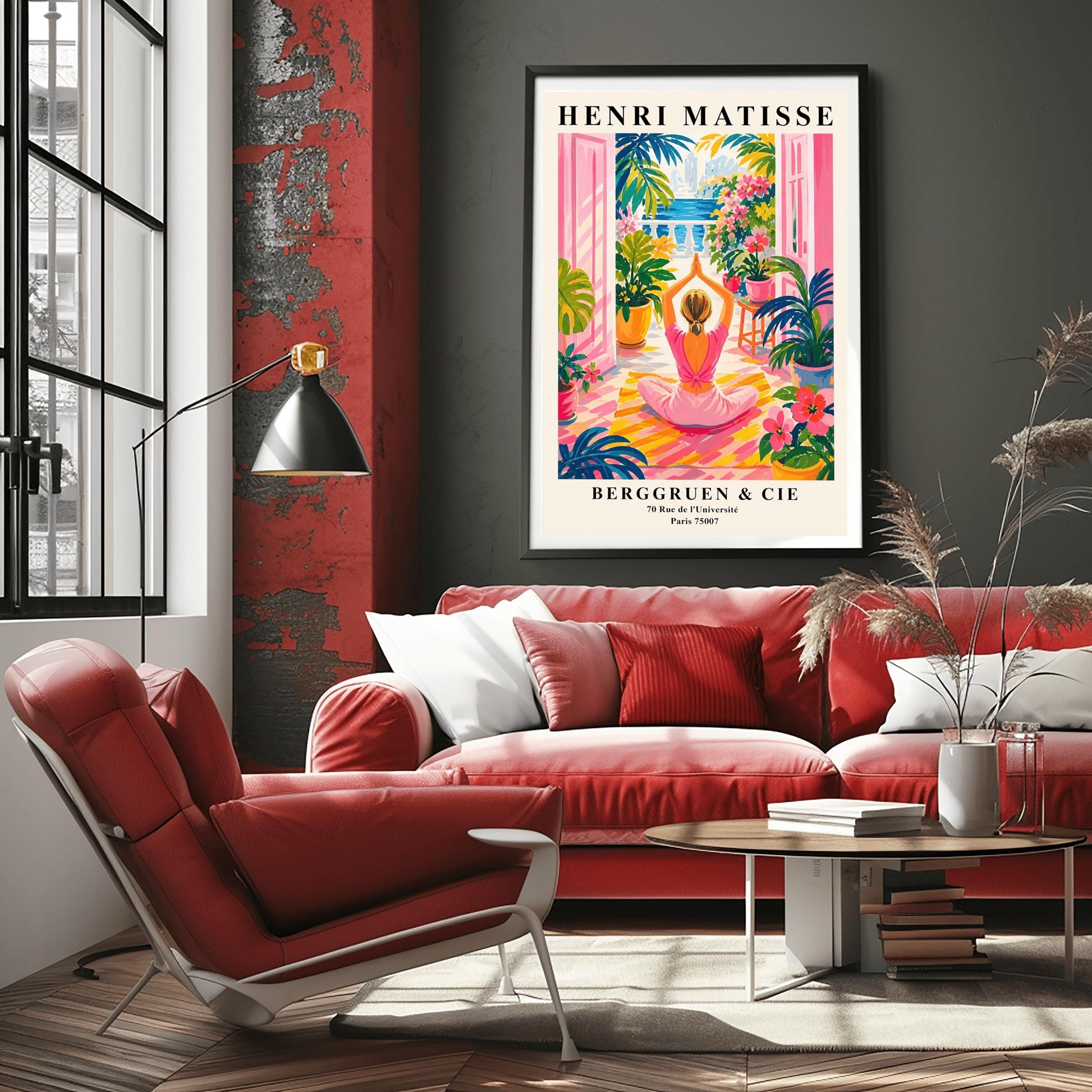 A vertical maximalist art print styled as a Henri Matisse exhibition poster. A woman with blonde hair tied back is seen from behind, sitting on a yellow-and-orange striped yoga mat in a yoga pose with her hands joined above her head. She faces open pink French doors that lead to a balcony with a view of a blue sea and a distant city. The terrace is filled with vibrant pink flowers, large green tropical plants in yellow pots, and a small wooden stool.