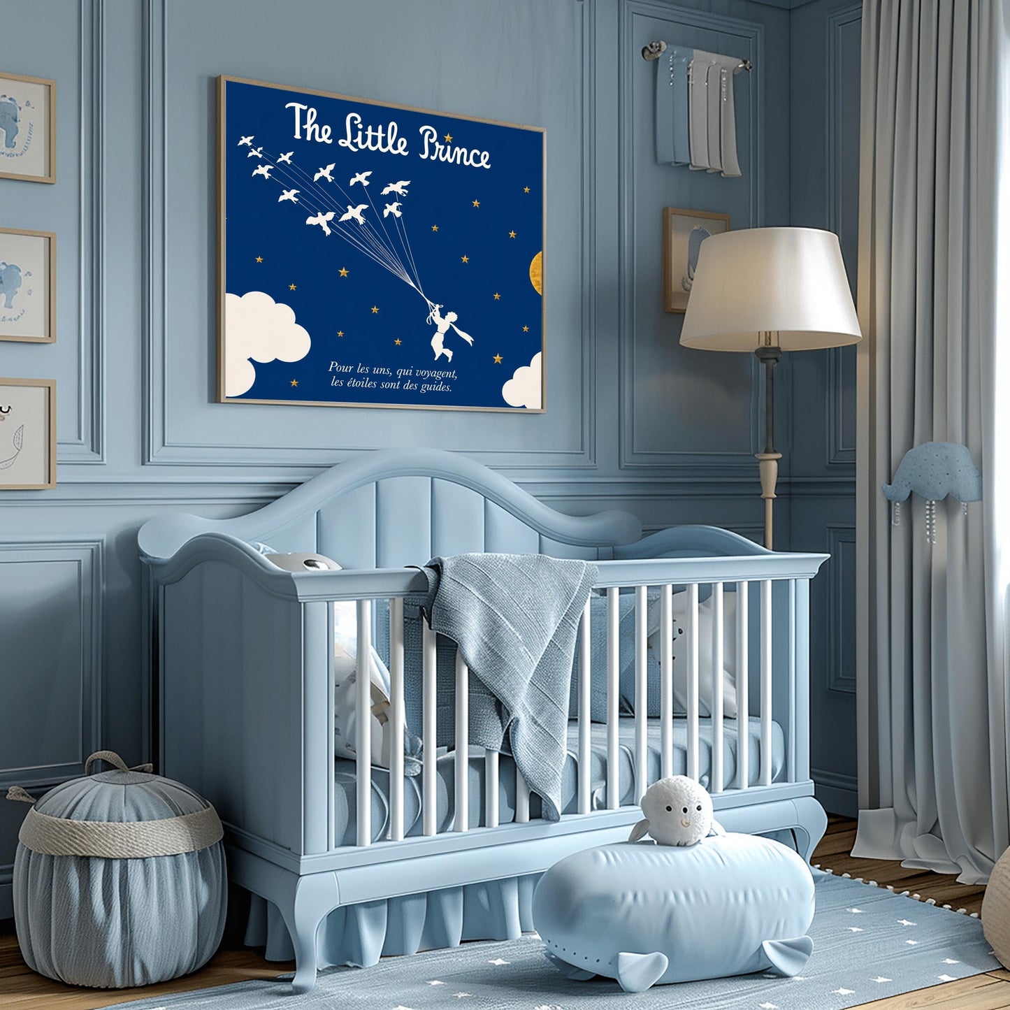 A horizontal illustration of the Little Prince flying through a navy blue night sky. In the center, a white silhouette of the prince holds onto a cluster of fine strings attached to a flock of twelve white wild birds flying upwards and to the left. The sky is filled with small gold stars and features a large, textured gold circular moon on the right, with soft white clouds along the bottom edges