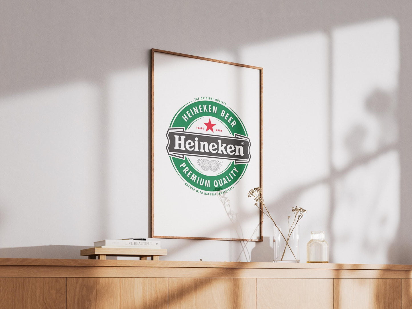 A sharp, bold art print featuring the iconic Heineken beer logo. The design prominently displays the vibrant green background, the distinct red star, and the crisp white 'Heineken' typography. This clean, graphic representation of the famous beverage brand is perfect for modern bar decor, a stylish man cave, pub wall art, or a contemporary kitchen. It's an ideal digital print gift for any Heineken enthusiast or collector of iconic beer branding, adding a sleek touch to any space.