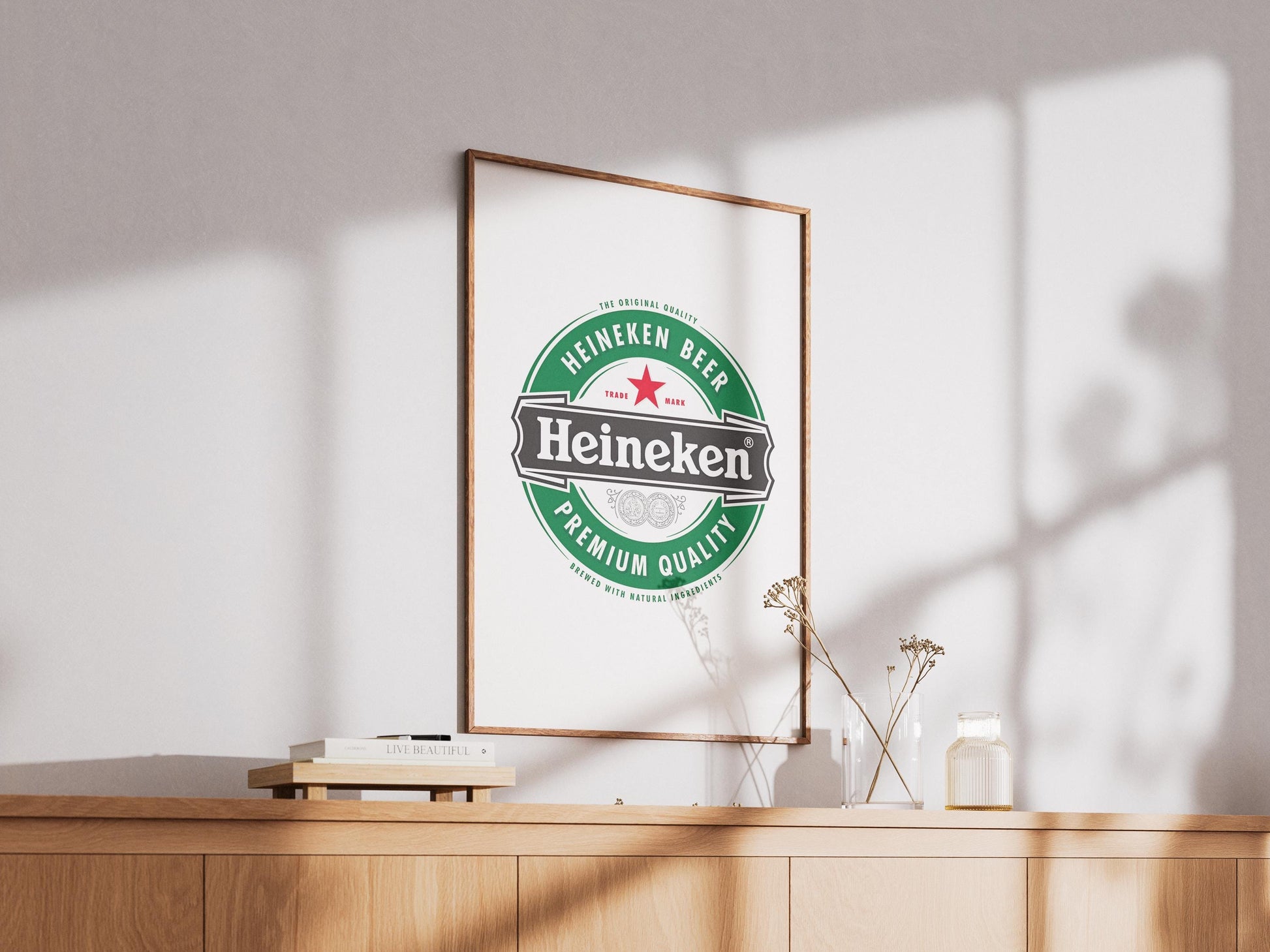 A sharp, bold art print featuring the iconic Heineken beer logo. The design prominently displays the vibrant green background, the distinct red star, and the crisp white 'Heineken' typography. This clean, graphic representation of the famous beverage brand is perfect for modern bar decor, a stylish man cave, pub wall art, or a contemporary kitchen. It's an ideal digital print gift for any Heineken enthusiast or collector of iconic beer branding, adding a sleek touch to any space.