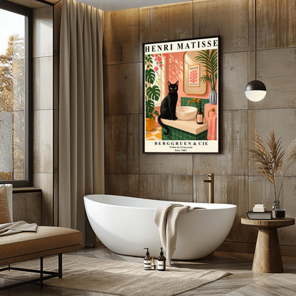 A vertical art print styled as a Henri Matisse exhibition poster. A sleek black cat with bright green eyes sits on a cream-colored bathroom vanity next to a white vessel sink. The bathroom features blush pink walls and emerald green tiles. A gold-framed mirror reflects a Matisse leaf print. Lush green plants and pink flowers frame the scene, and dappled sunlight creates shadows on the wall. The poster has bold black text at the top and bottom with the gallery name Berggruen & Cie.