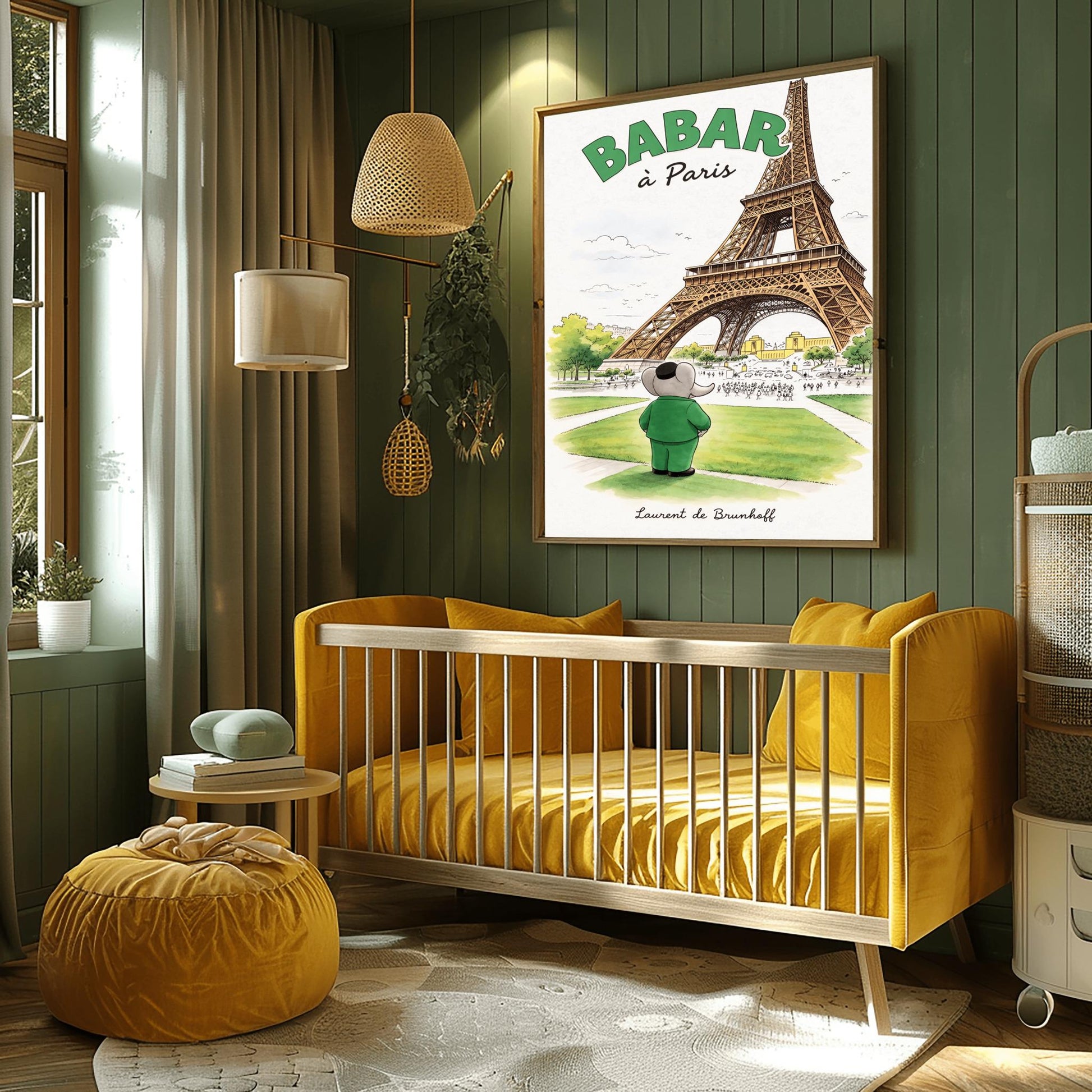 A vertical art print titled "BABAR à Paris" in large green letters. A grey elephant, Babar, seen from behind wearing a green suit and black cap, stands on a green lawn looking toward the massive Eiffel Tower. The scene includes green trees, a distant cityscape with crowds of people, and a soft blue sky. The artist's name, "Laurent de Brunhoff," is printed in script at the bottom.