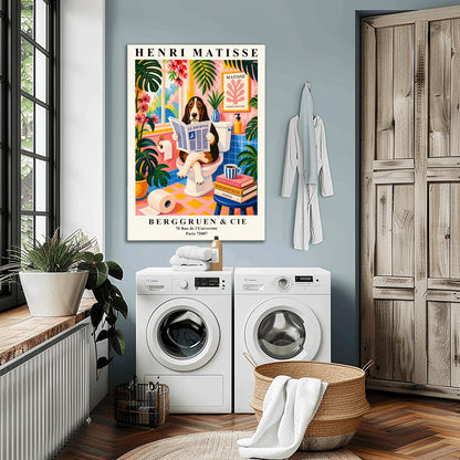 A vertical maximalist art print designed as a Henri Matisse exhibition poster. A brown, black, and white Basset Hound is sitting on a white toilet with its legs crossed, holding and reading a newspaper titled "Le Journal." The bathroom is vibrantly colored with pink walls, blue wall tiles, and a pink and yellow checkered floor. The room is filled with large green tropical plants and red flowers. A stack of art books and a striped mug sit on a blue stool.