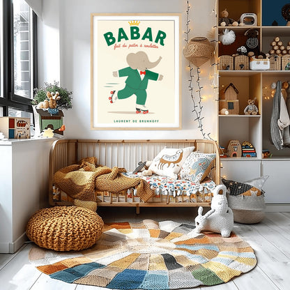 A vertical storybook-style art print of Babar the Elephant roller skating against a cream background. Babar is wearing his signature green suit and red bow tie. He is balanced on white roller skates with red wheels, with one foot lifted behind him. The top of the print features the word "BABAR" in large green letters above the red script text "fait du patin à roulettes" and a small gold crown. The name "LAURENT DE BRUNHOFF" is printed at the bottom.