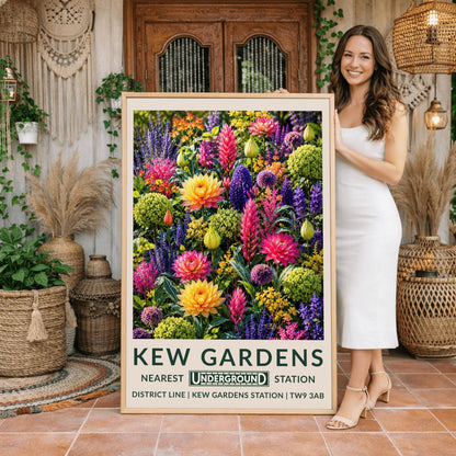 A vertical retro London Underground travel poster for Kew Gardens on a wide cream border. The top image shows a densely packed botanical illustration of a vibrant summer flower border featuring large orange-yellow and magenta dahlias, tall pink flower spikes, purple alliums, violet lupines, and chartreuse green clusters. The bottom cream border features the text "KEW GARDENS" in dark green, followed by "NEAREST UNDERGROUND STATION"