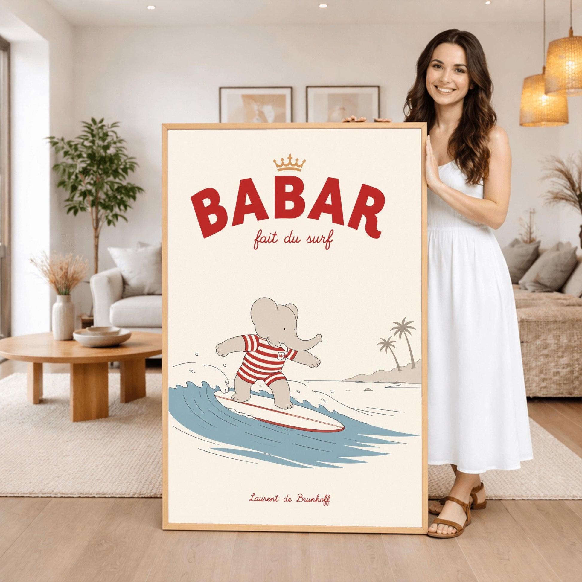 A vertical storybook-style art print of Babar the Elephant surfing. Babar is wearing a red and white striped swimsuit and standing on a white surfboard with a red stripe. He is riding a blue wave with a white crest. In the background, there is a tan beach with two palm trees under a cream sky. The top reads "BABAR fait du surf" with a small gold crown.