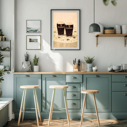 A vertical illustration of two pints of Guinness stout sitting side-by-side on a light cream surface. Green shamrocks and confetti are scattered around the base of the glasses. The pints feature the golden harp logo. The overall style is painterly and warm.