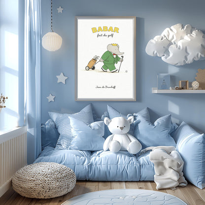 A vertical art print titled "BABAR fait du golf" in yellow letters. A grey elephant, Babar, is wearing a green suit, a red bow tie, and a gold crown. He is walking across a simple beige ground, holding a golf club and pulling a tan golf bag on a small two-wheeled cart. A single golf ball sits on the ground in front of him. The background is a minimalist off-white texture, and "Jean de Brunhoff" is written at the bottom.