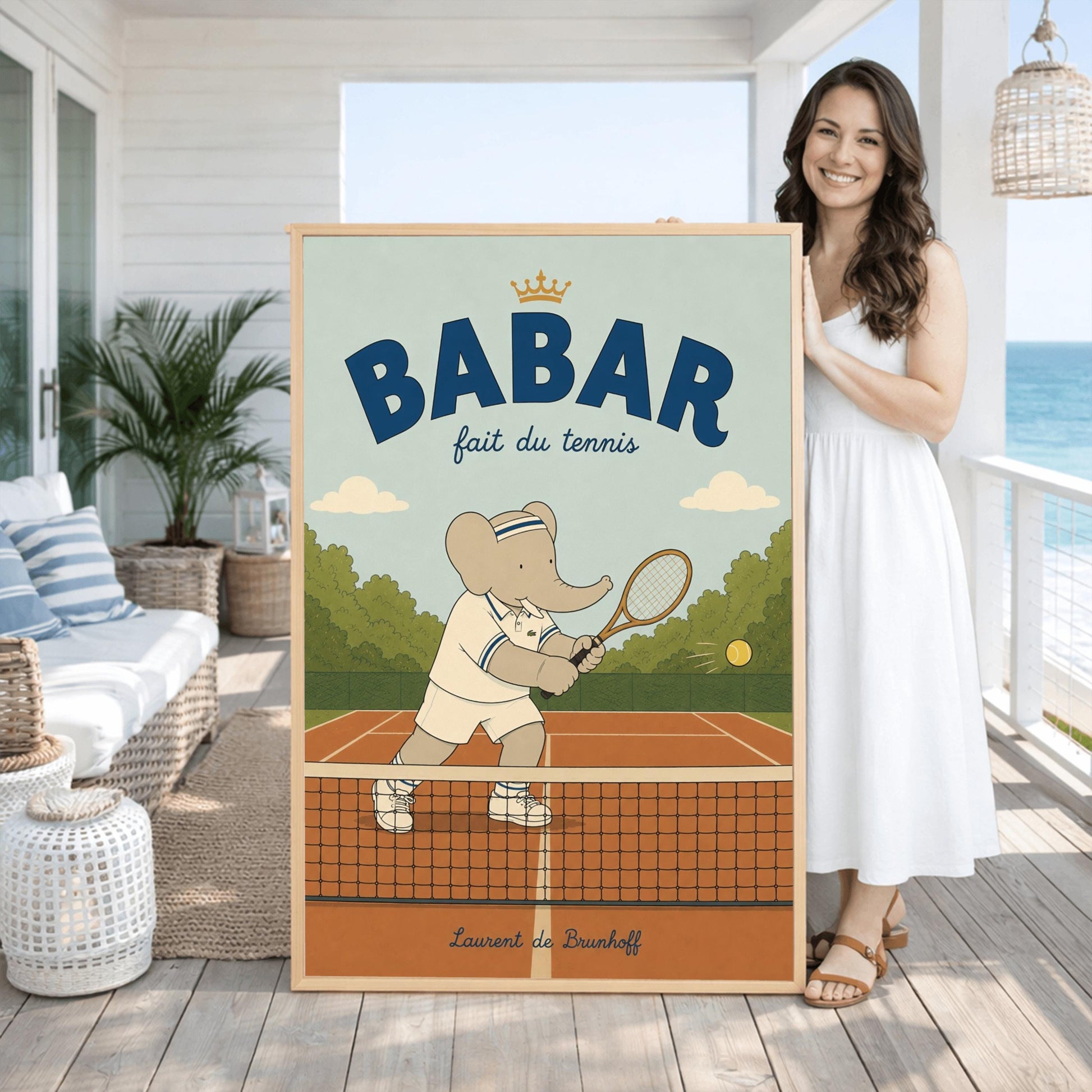 A vertical storybook-style art print featuring Babar the Elephant playing tennis. Babar is seen behind a tennis net on an orange clay court, holding a wooden racket in a backhand swing. He wears a white polo with blue stripes, white shorts, and a blue-and-white striped headband. A yellow tennis ball is in mid-air. The background has green trees and a light blue sky. The top reads "BABAR fait du tennis" with a small gold crown.