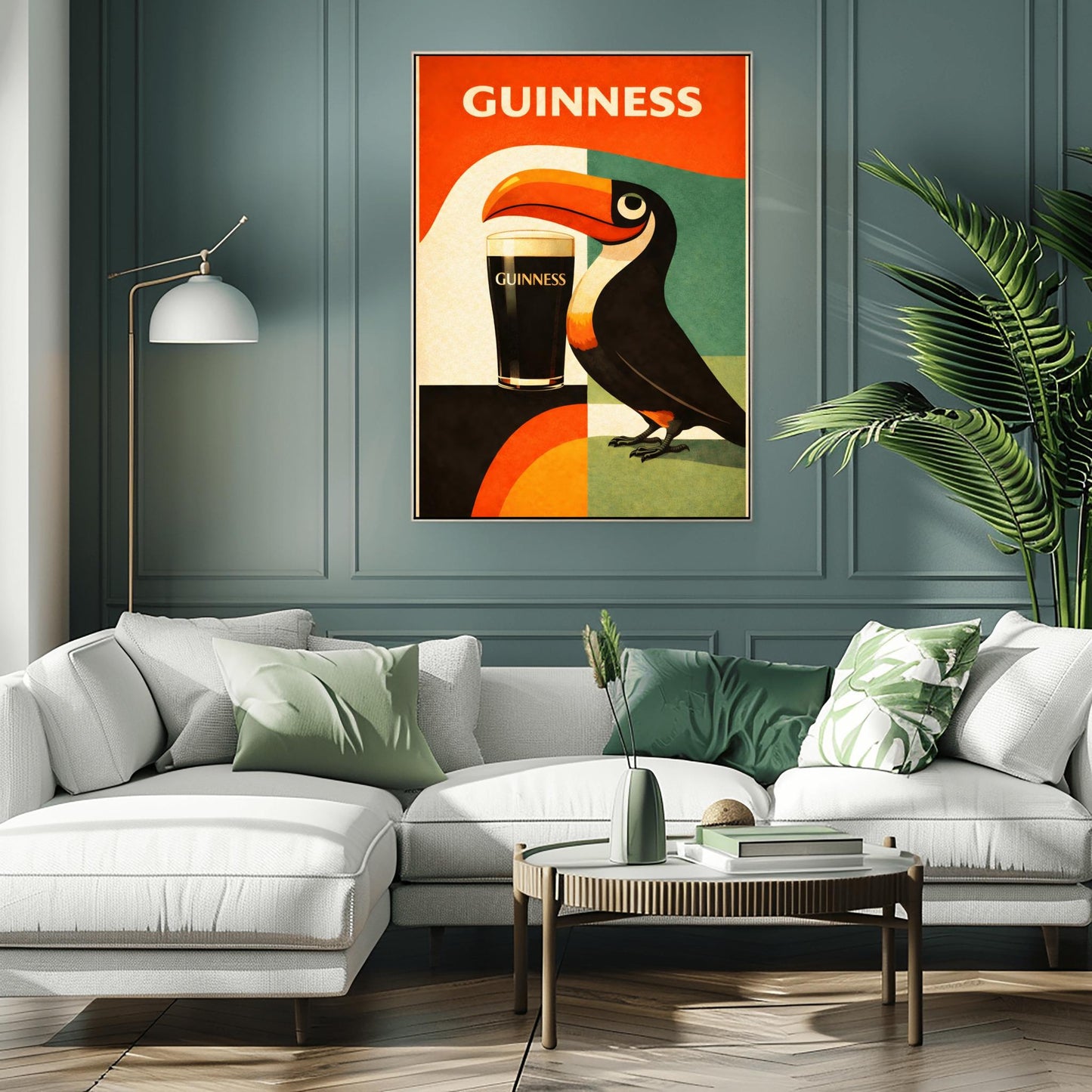 A vertical minimalist poster for Guinness in a mid-century modern style. A stylized, geometric toucan stands next to a pint of beer. The background is made of large blocks of orange, teal, and black. Bold white text at the top reads "GUINNESS."