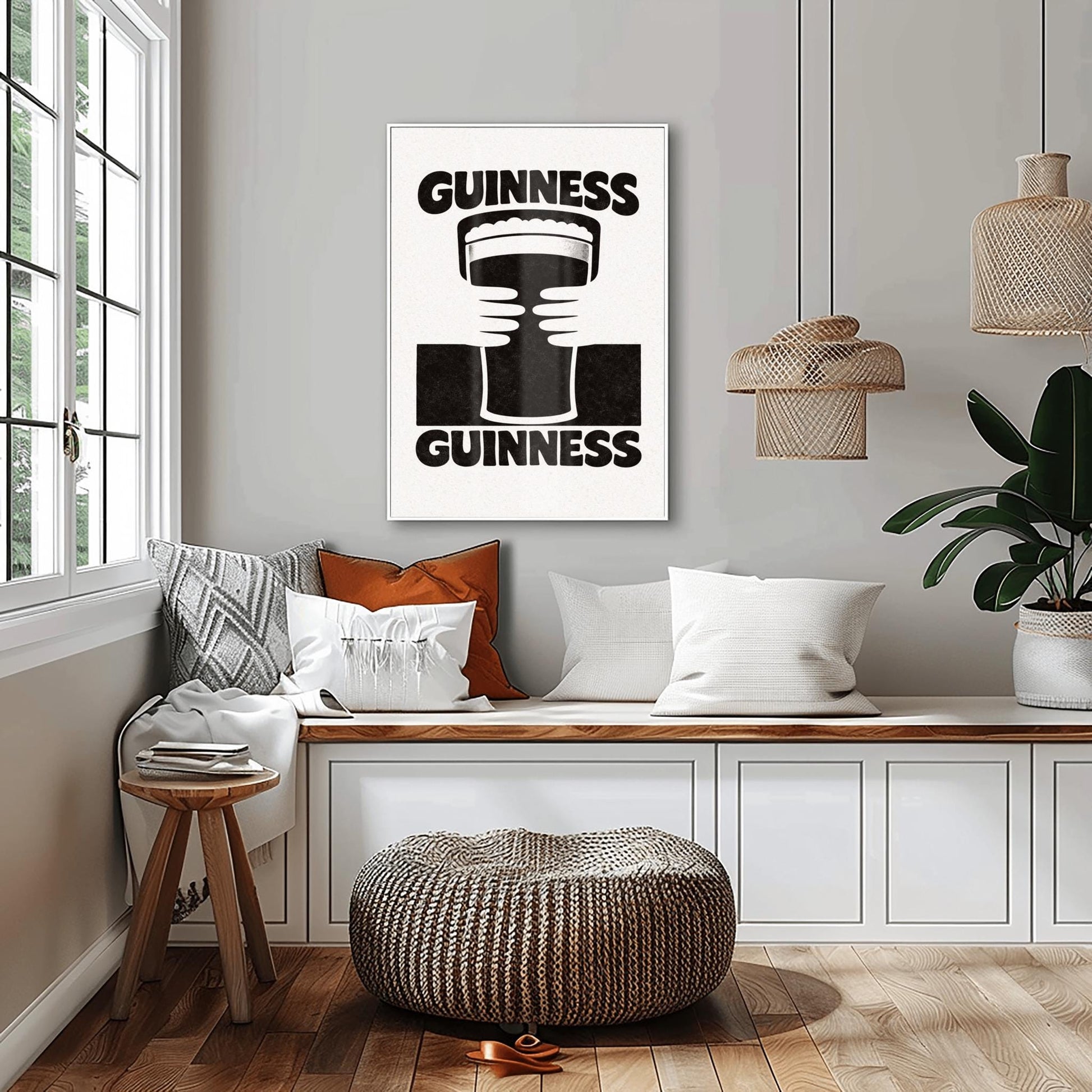 A vertical black and white minimalist graphic. Two white hands hold a central pint of Guinness from both sides. The word "GUINNESS" appears in bold black text both at the top and the bottom of the cream-colored background.