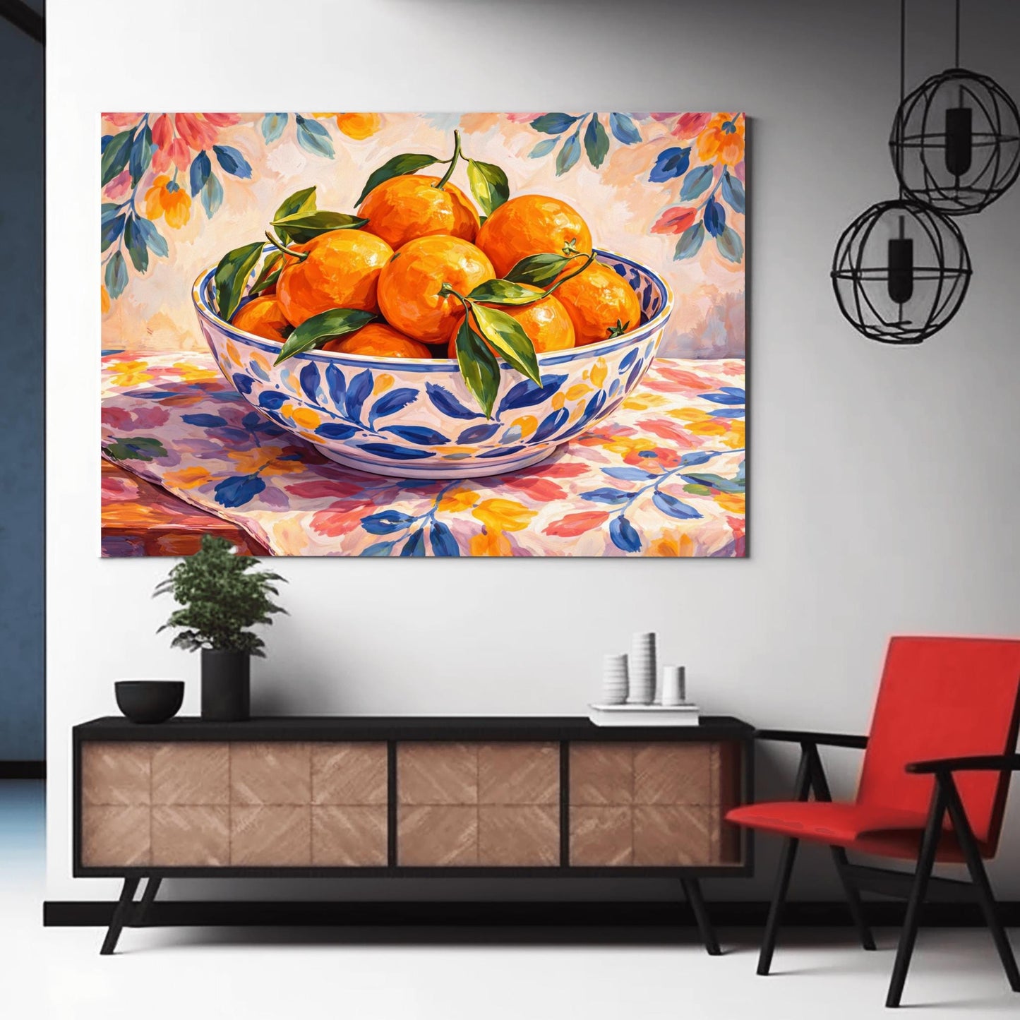 A horizontal painterly illustration of a large blue and white patterned ceramic bowl filled with bright oranges and green leaves. The bowl sits on a table covered with a pink and yellow floral cloth, with a matching soft floral pattern in the background.