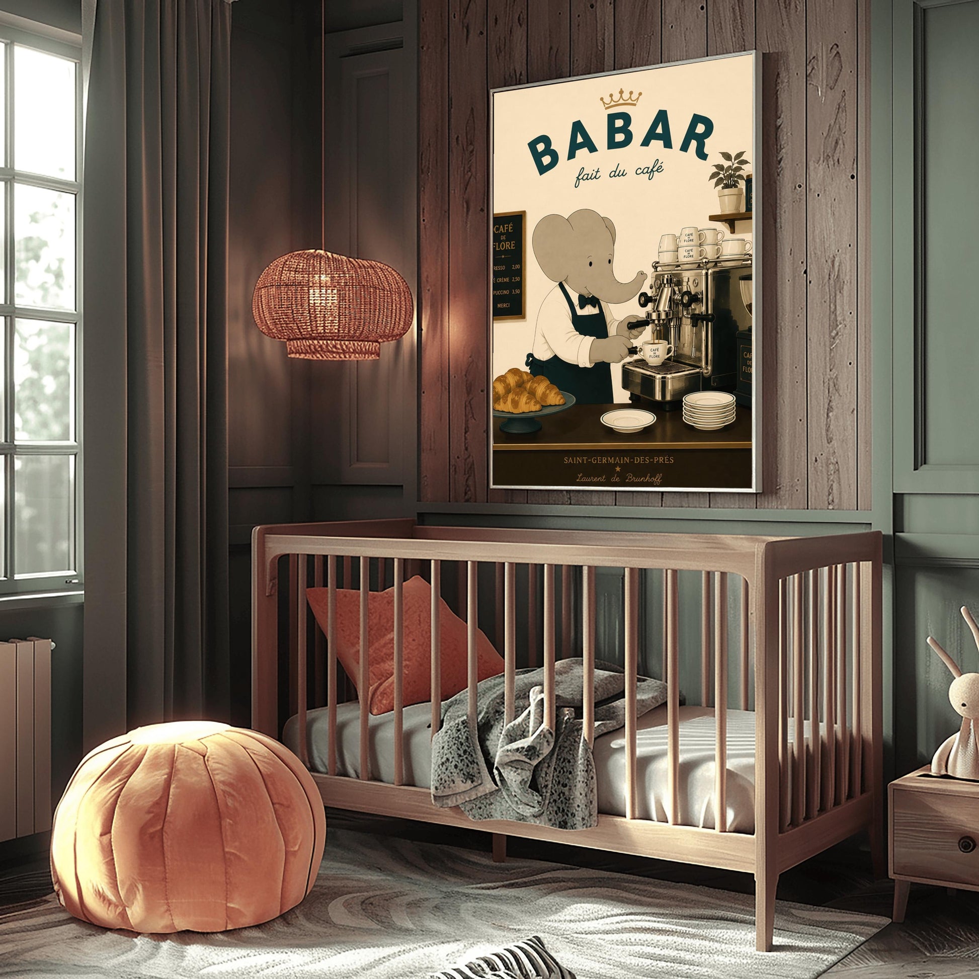 A vintage-style illustration of Babar the Elephant wearing a white shirt, black bowtie, and dark apron, working as a barista. He is operating a classic silver espresso machine in a Parisian café. The scene includes a plate of croissants, stacks of "Café de Flore" cups, and a menu board. The text at the top reads "BABAR fait du café" with a gold crown, and the bottom features "Saint-Germain-des-Prés" and the name "Laurent de Brunhoff."