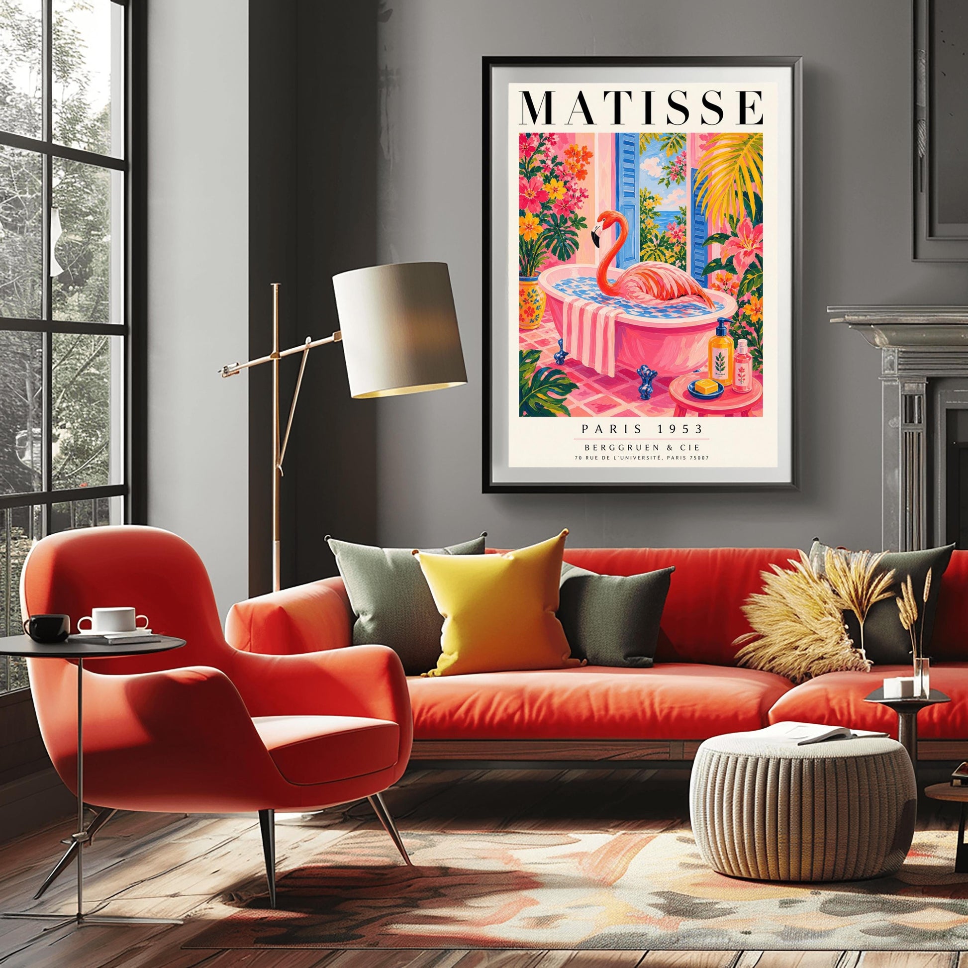 A vertical maximalist art print styled as a Henri Matisse exhibition poster. A vibrant pink flamingo with its long neck curved sits elegantly in a pink clawfoot bathtub. The bathroom features pink tiled floors and walls, with open blue shutters in the background looking out to the sea. The room is filled with tropical greenery and bright pink and orange flowers. A small pink table in the foreground holds soap and cosmetic bottles.